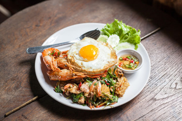 Fried egg and  seafood with rice