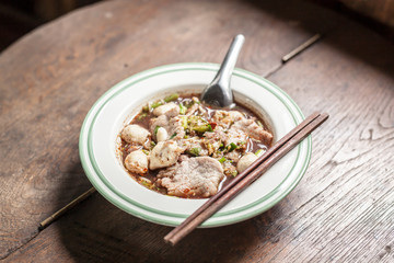 bowl of noodles  on wooden table
