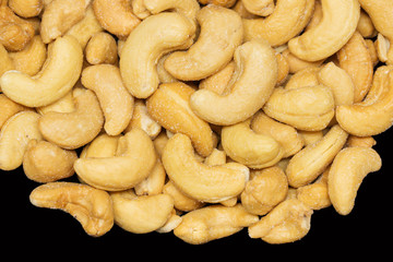 Cashew nuts on the black background.