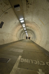 The Greenwich Foot Tunnel crosses beneath the River Thames in East London, linking Greenwich in the south with the Isle of Dogs to the north..