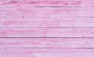 Old wooden planks painted with pink paint