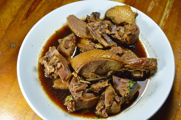 steamed duck meat in Chinese brown soup on plate