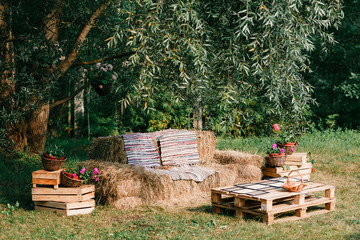 sofa made from straw, outdoor furniture, cowboy party. wooden of a pallet