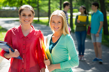 Female students outdoors with friends