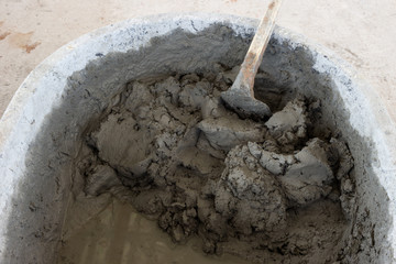 building construction wall. mix cement plaster concrete in  bucket