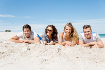 Fototapeta premium Company of young people on the beach