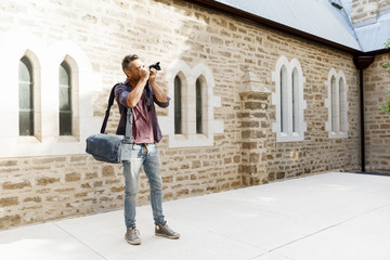 Male photographer taking picture