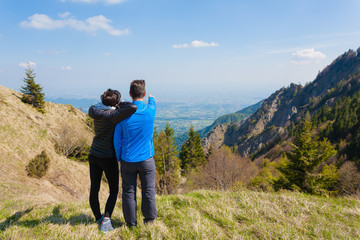 Fototapeta na wymiar Young couple on top of a mountain