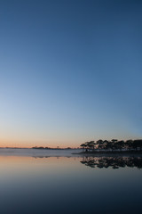 View of reservoir on sunrise sky background.
