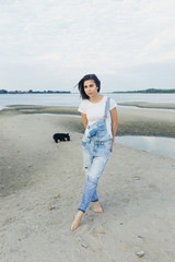 brunette travels on the beach