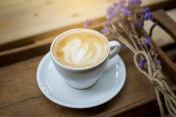 hot latte art on wood table background