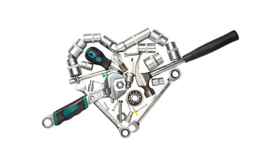 Tools arranged in a heart shape isolated on white background.