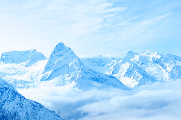 Fototapeta na wymiar beautiful winter snow covered peaks of Caucasus mountain, Dombaj
