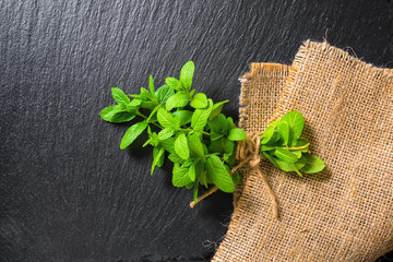beautiful bunch fresh green lemon mint tied twine on slate and b