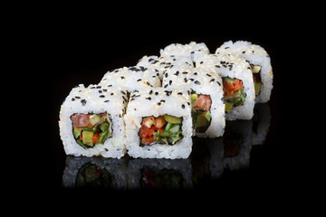 Japanese rolls on black background