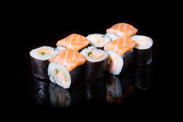 Japanese rolls on black background