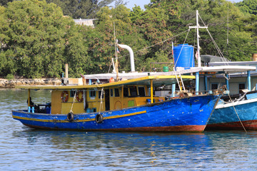 Fototapeta premium fishing boat park at harbor