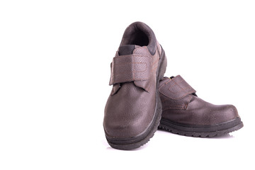 Old black safety shoe isolated on white background