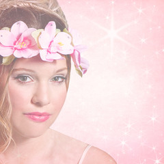 Obraz na płótnie Canvas Sweet feminine background with teen girl wearing a pink floral wreath around her head. Soft and muted blended in to pastel pink textured background with star-like flares.