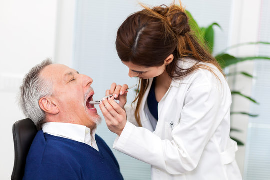 Doctor examining a patient in her office