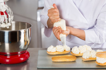 Pastry chef decorating - 116489789