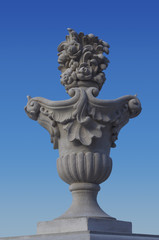 Fototapeta premium Decorative vase as a design element exterior against a blue sky