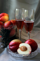 Glasses of champagne and nectarines..