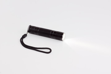 working flashlight on a white background