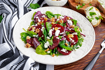 Healthy Beet Salad with fresh sweet baby spinach, kale lettuce, nuts, feta cheese and toast  melted 
