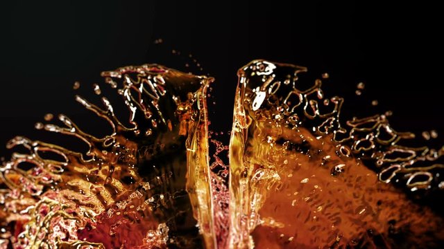 Liquid Splash. Alcohol, Tea, Cola. Super Slow motion.