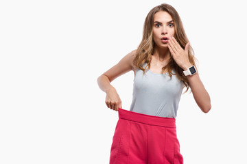 Pleasant slim woman standing on white background
