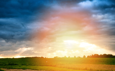 Dramatic sunset over fields