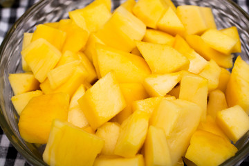 Fresh and juicy slice of mango in bowl