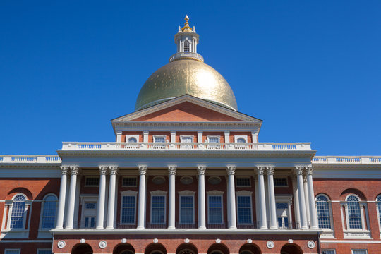 Massachusetts State House in Boston under the blue sky.