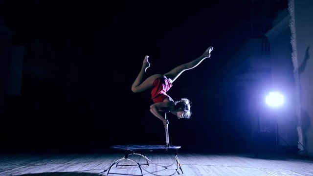 Flexible woman doing contortion on stage