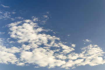 blue sky background with tiny clouds