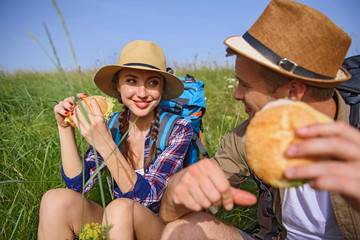Pretty loving couple enjoying nature and food