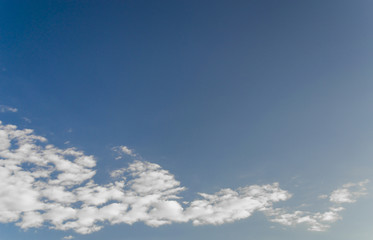 blue sky background with tiny clouds
