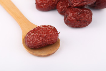 Dateds in a wooden spoon