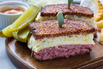 Classic reuben sandwich, served with dill pickle, potato chips, horizontal