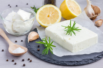 Ingredients for feta, cream cheese, rosemary, lemon and garlic dip