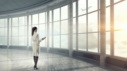 Businesswoman in modern office interior  . Mixed media