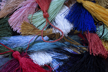 This is a photograph of colorful thread tassels