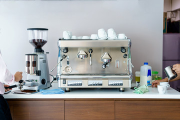 Man makes coffee with a machine