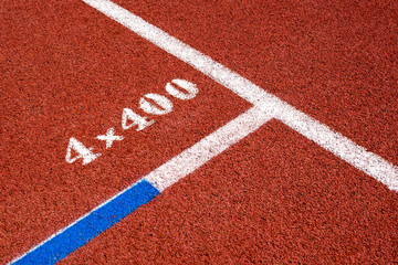 Red running track texture.
