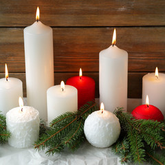 burning christmas candles and spruce