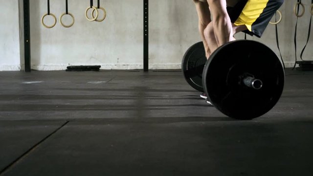 Closeup of athlete doing deadlift weightlifting exercise