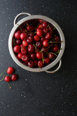  Fresh organic cherries in colander.