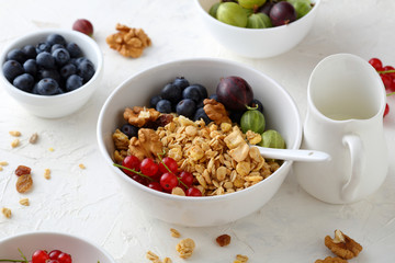 granola in bowl with  summer berries