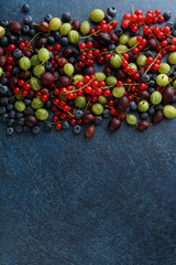 Summer berries on stone background.